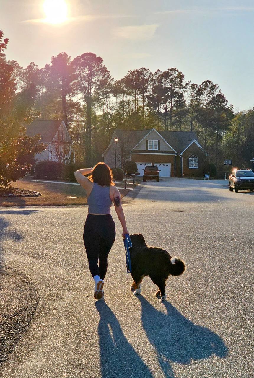 Claire taking an evening walk in a grey active top and black leggings